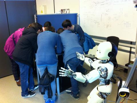students play hide and seek with a humanoid robot